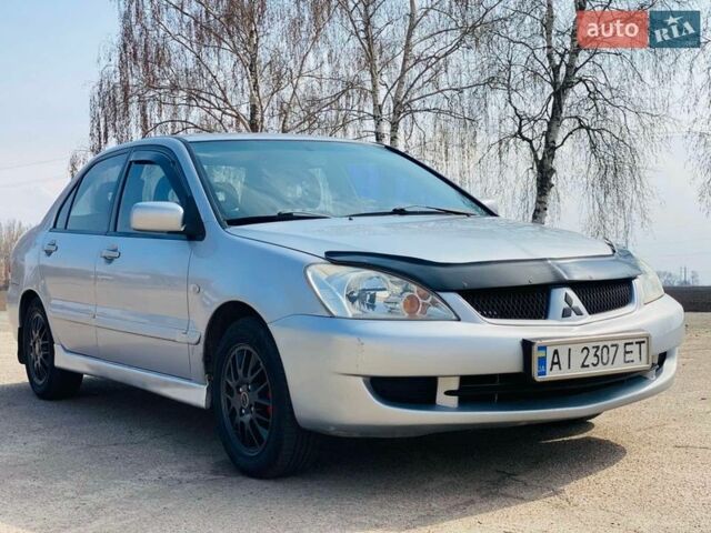 Серый Мицубиси Лансер, объемом двигателя 1.58 л и пробегом 369 тыс. км за 2600 $, фото 1 на Automoto.ua
