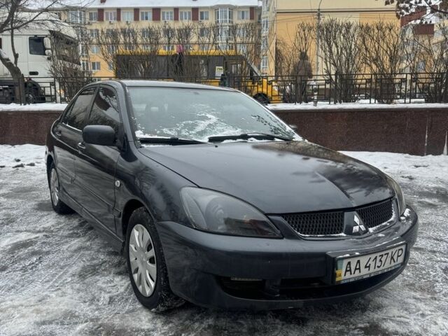 Серый Мицубиси Лансер, объемом двигателя 1.6 л и пробегом 360 тыс. км за 3900 $, фото 1 на Automoto.ua