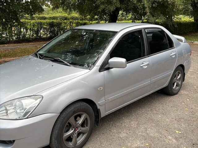 Сірий Міцубісі Lancer, об'ємом двигуна 1.6 л та пробігом 294 тис. км за 3350 $, фото 1 на Automoto.ua