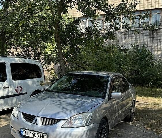 Сірий Міцубісі Lancer, об'ємом двигуна 1.6 л та пробігом 269 тис. км за 2998 $, фото 1 на Automoto.ua