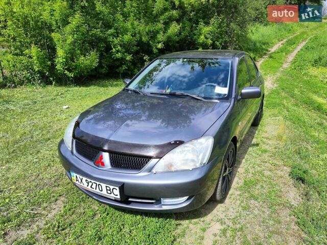 Серый Мицубиси Лансер, объемом двигателя 1.6 л и пробегом 131 тыс. км за 5499 $, фото 1 на Automoto.ua