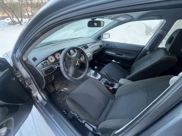 Серый Мицубиси Лансер, объемом двигателя 1.6 л и пробегом 270 тыс. км за 4900 $, фото 1 на Automoto.ua