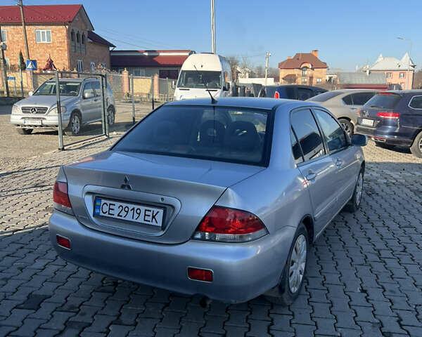 Сірий Міцубісі Lancer, об'ємом двигуна 1.58 л та пробігом 180 тис. км за 3800 $, фото 1 на Automoto.ua