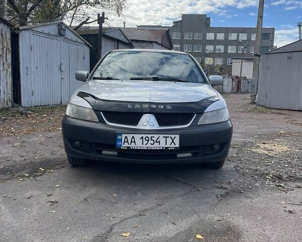 Сірий Міцубісі Lancer, об'ємом двигуна 1.58 л та пробігом 305 тис. км за 3300 $, фото 1 на Automoto.ua