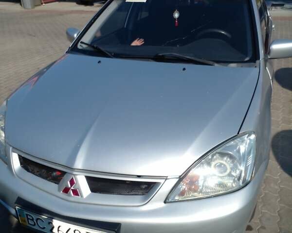 Серый Мицубиси Лансер, объемом двигателя 1.6 л и пробегом 210 тыс. км за 3500 $, фото 1 на Automoto.ua