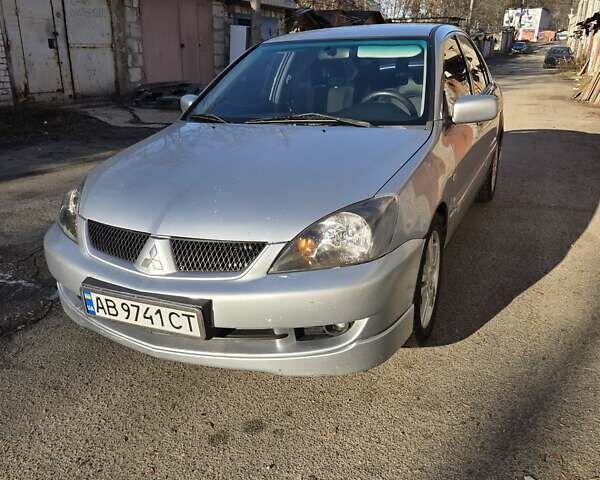 Серый Мицубиси Лансер, объемом двигателя 2 л и пробегом 353 тыс. км за 4800 $, фото 1 на Automoto.ua