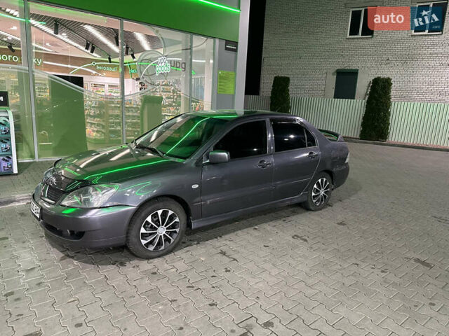 Серый Мицубиси Лансер, объемом двигателя 1.6 л и пробегом 112 тыс. км за 2800 $, фото 1 на Automoto.ua