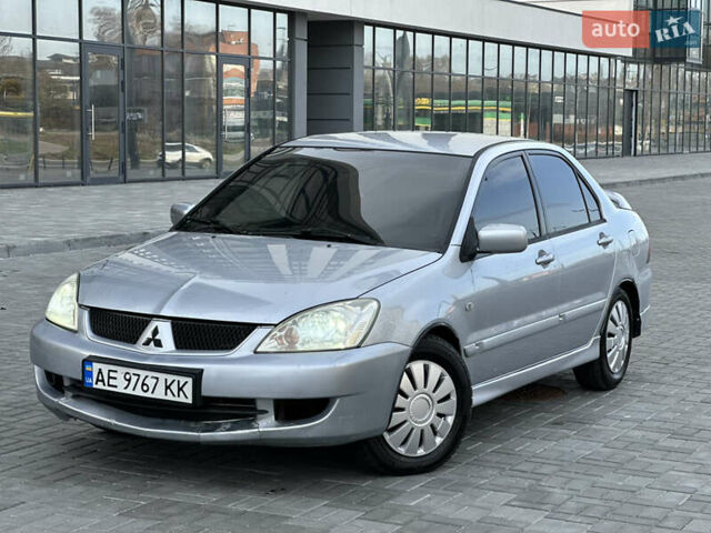 Серый Мицубиси Лансер, объемом двигателя 1.6 л и пробегом 200 тыс. км за 3900 $, фото 1 на Automoto.ua