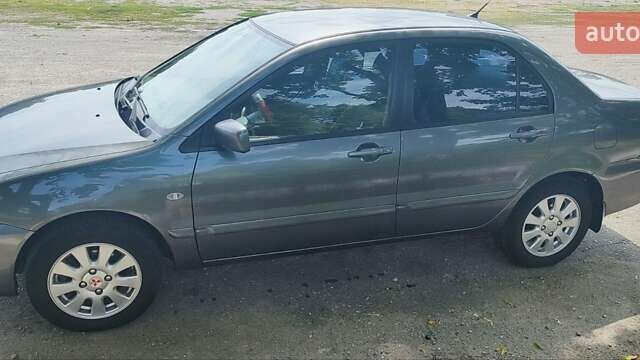 Сірий Міцубісі Lancer, об'ємом двигуна 1.6 л та пробігом 234 тис. км за 4500 $, фото 1 на Automoto.ua