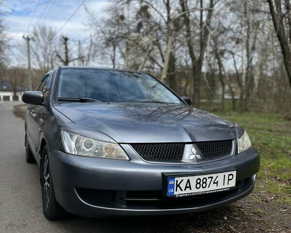 Серый Мицубиси Лансер, объемом двигателя 1.58 л и пробегом 272 тыс. км за 4500 $, фото 1 на Automoto.ua