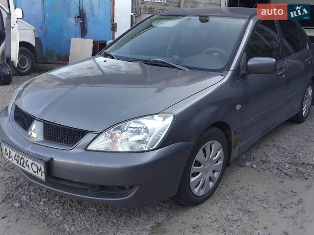 Сірий Міцубісі Lancer, об'ємом двигуна 1.6 л та пробігом 390 тис. км за 1900 $, фото 1 на Automoto.ua