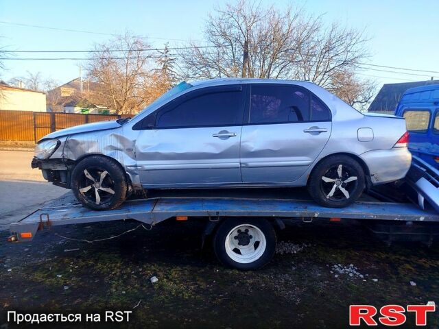 Серый Мицубиси Лансер, объемом двигателя 1.6 л и пробегом 0 тыс. км за 750 $, фото 1 на Automoto.ua