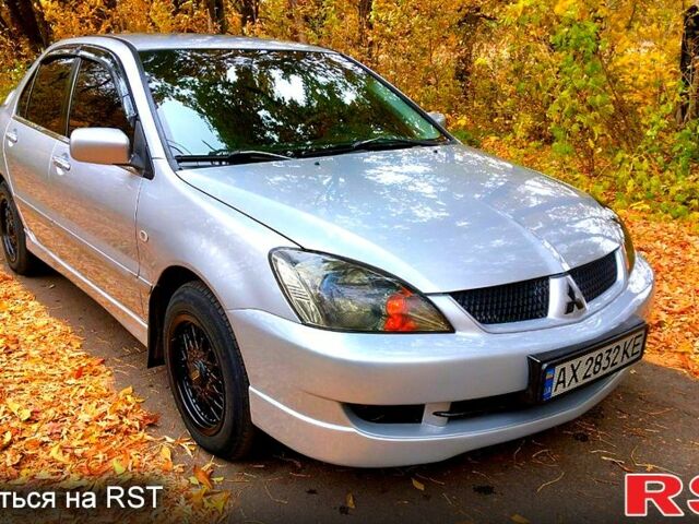 Серый Мицубиси Лансер, объемом двигателя 1.6 л и пробегом 203 тыс. км за 4600 $, фото 1 на Automoto.ua