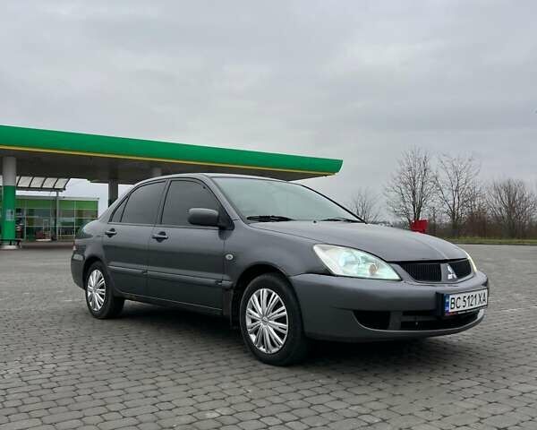 Сірий Міцубісі Lancer, об'ємом двигуна 1.6 л та пробігом 253 тис. км за 3100 $, фото 1 на Automoto.ua