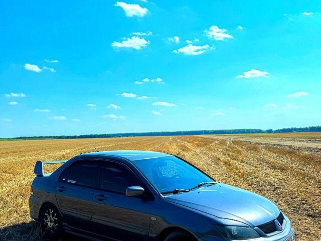 Серый Мицубиси Лансер, объемом двигателя 1.6 л и пробегом 285 тыс. км за 4500 $, фото 1 на Automoto.ua