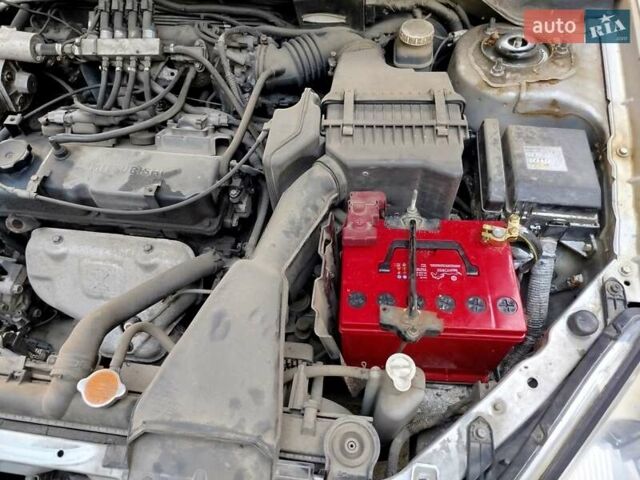 Серый Мицубиси Лансер, объемом двигателя 1.6 л и пробегом 232 тыс. км за 3700 $, фото 1 на Automoto.ua