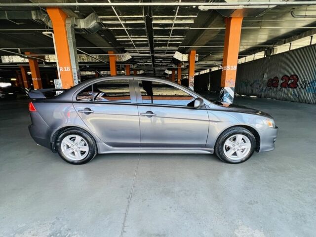 Сірий Міцубісі Lancer, об'ємом двигуна 2 л та пробігом 197 тис. км за 6200 $, фото 1 на Automoto.ua