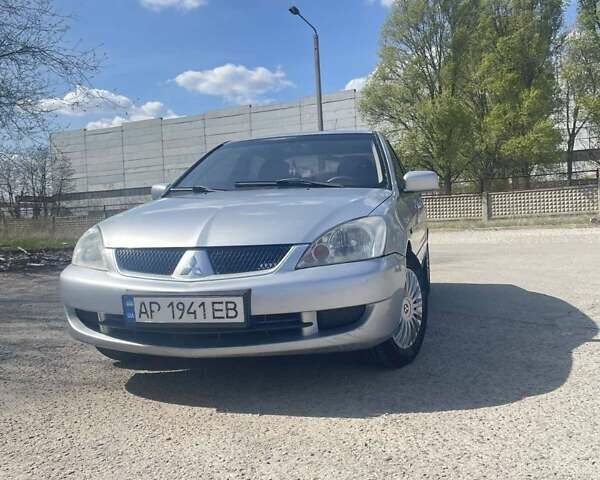 Сірий Міцубісі Lancer, об'ємом двигуна 1.58 л та пробігом 248 тис. км за 4999 $, фото 1 на Automoto.ua