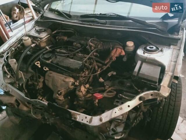 Серый Мицубиси Лансер, объемом двигателя 1.58 л и пробегом 240 тыс. км за 1500 $, фото 1 на Automoto.ua