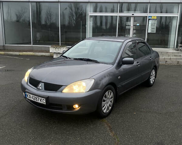Серый Мицубиси Лансер, объемом двигателя 1.6 л и пробегом 346 тыс. км за 4299 $, фото 1 на Automoto.ua