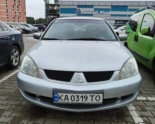 Сірий Міцубісі Lancer, об'ємом двигуна 1.58 л та пробігом 168 тис. км за 5700 $, фото 1 на Automoto.ua