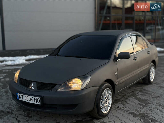 Сірий Міцубісі Lancer, об'ємом двигуна 1.58 л та пробігом 250 тис. км за 3750 $, фото 1 на Automoto.ua