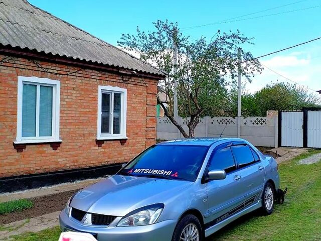 Сірий Міцубісі Lancer, об'ємом двигуна 1.6 л та пробігом 280 тис. км за 4800 $, фото 1 на Automoto.ua