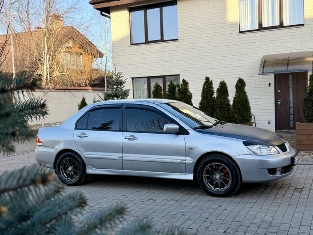 Серый Мицубиси Лансер, объемом двигателя 1.6 л и пробегом 273 тыс. км за 3600 $, фото 1 на Automoto.ua