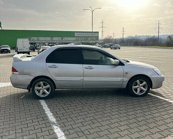 Серый Мицубиси Лансер, объемом двигателя 1.6 л и пробегом 171 тыс. км за 3800 $, фото 1 на Automoto.ua