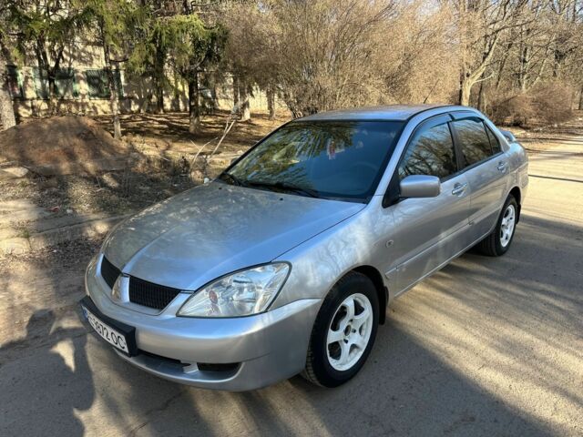 Серый Мицубиси Лансер, объемом двигателя 1.6 л и пробегом 220 тыс. км за 3600 $, фото 1 на Automoto.ua