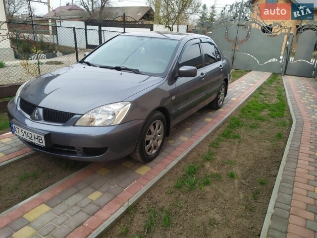 Сірий Міцубісі Lancer, об'ємом двигуна 1.58 л та пробігом 202 тис. км за 3300 $, фото 1 на Automoto.ua