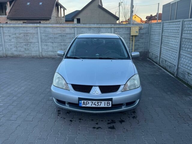 Серый Мицубиси Лансер, объемом двигателя 1.6 л и пробегом 256 тыс. км за 4500 $, фото 1 на Automoto.ua
