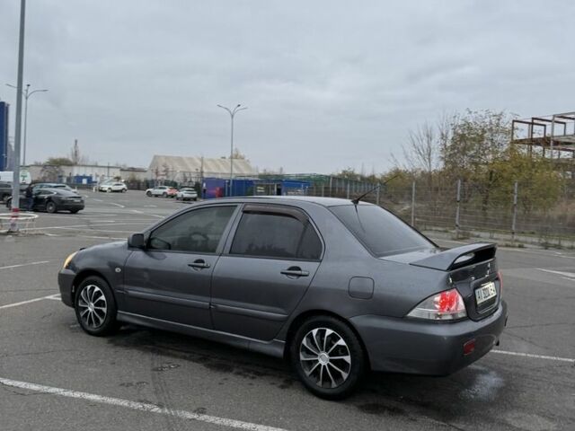 Серый Мицубиси Лансер, объемом двигателя 1.6 л и пробегом 350 тыс. км за 2850 $, фото 1 на Automoto.ua