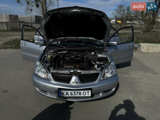 Серый Мицубиси Лансер, объемом двигателя 1.58 л и пробегом 261 тыс. км за 4500 $, фото 1 на Automoto.ua