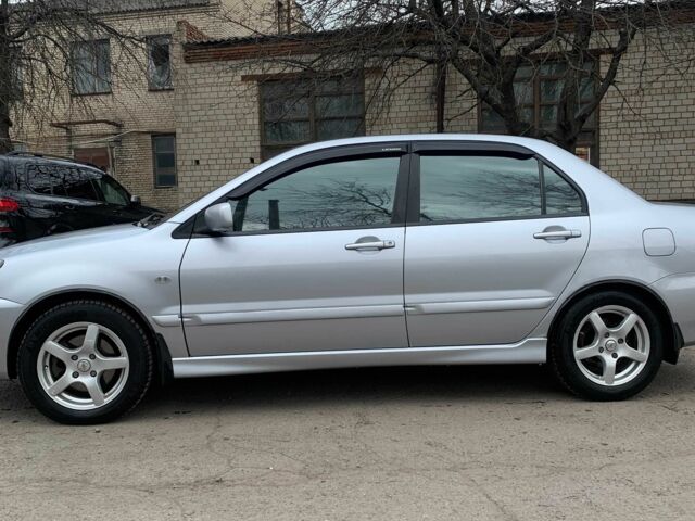 Сірий Міцубісі Lancer, об'ємом двигуна 1.6 л та пробігом 347 тис. км за 4500 $, фото 1 на Automoto.ua