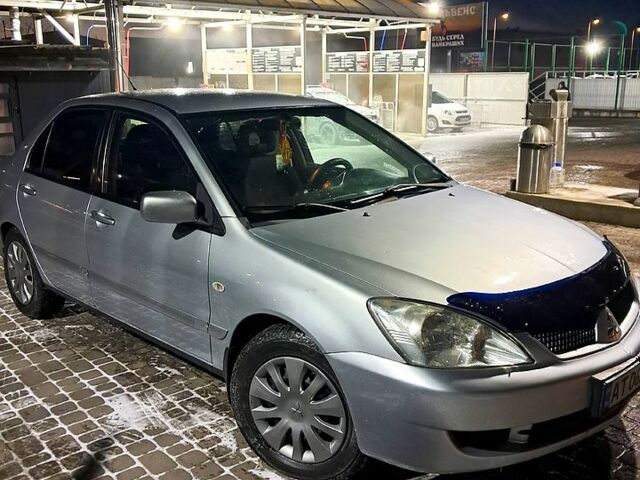Сірий Міцубісі Lancer, об'ємом двигуна 1.6 л та пробігом 244 тис. км за 3900 $, фото 1 на Automoto.ua