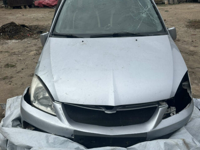 Сірий Міцубісі Lancer, об'ємом двигуна 1.58 л та пробігом 210 тис. км за 1300 $, фото 1 на Automoto.ua