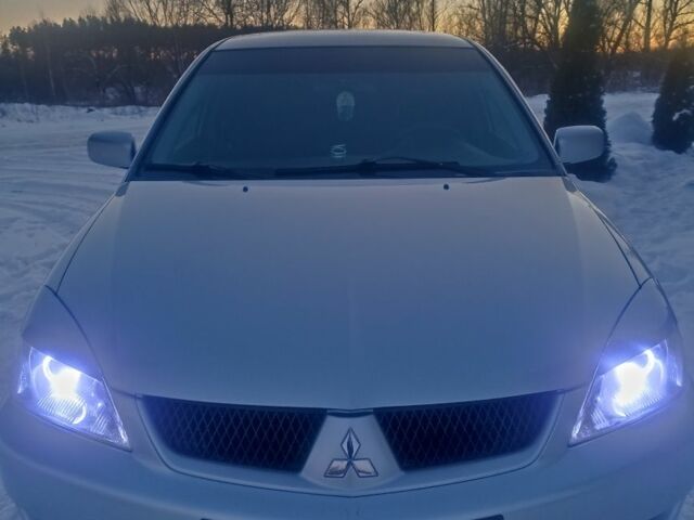 Сірий Міцубісі Lancer, об'ємом двигуна 1.6 л та пробігом 219 тис. км за 4400 $, фото 1 на Automoto.ua