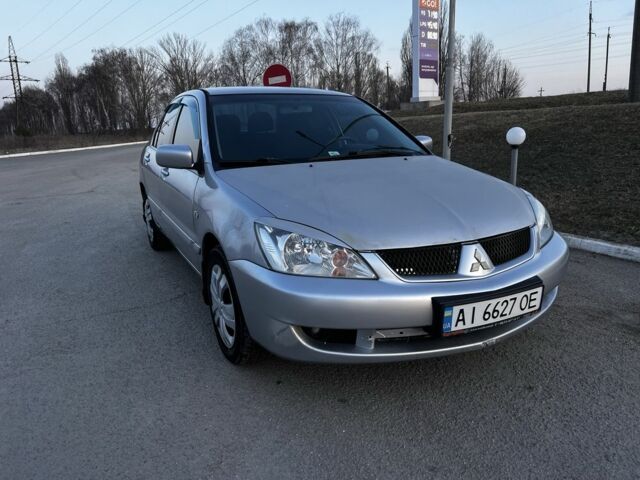 Серый Мицубиси Лансер, объемом двигателя 1.6 л и пробегом 217 тыс. км за 3300 $, фото 1 на Automoto.ua