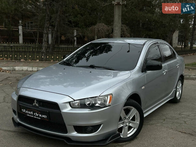 Серый Мицубиси Лансер, объемом двигателя 2 л и пробегом 199 тыс. км за 7499 $, фото 1 на Automoto.ua