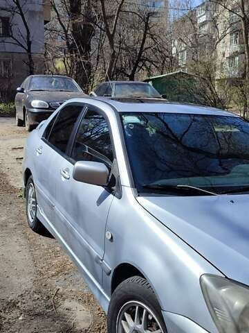 Серый Мицубиси Лансер, объемом двигателя 2 л и пробегом 297 тыс. км за 4600 $, фото 1 на Automoto.ua