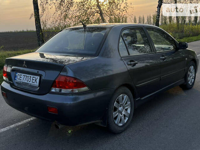 Сірий Міцубісі Lancer, об'ємом двигуна 1.6 л та пробігом 207 тис. км за 4800 $, фото 1 на Automoto.ua