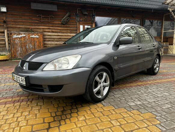 Серый Мицубиси Лансер, объемом двигателя 1.6 л и пробегом 213 тыс. км за 2400 $, фото 1 на Automoto.ua