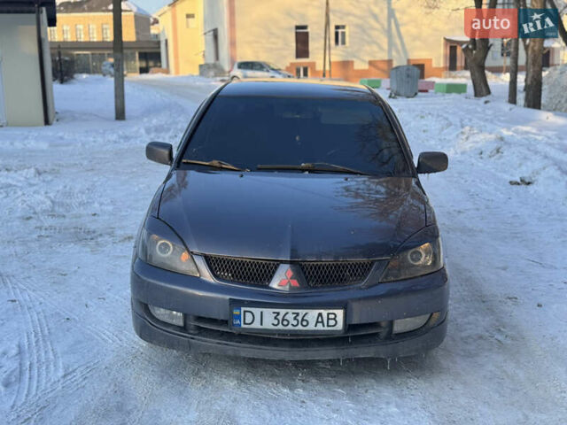 Сірий Міцубісі Lancer, об'ємом двигуна 1.58 л та пробігом 200 тис. км за 3200 $, фото 1 на Automoto.ua