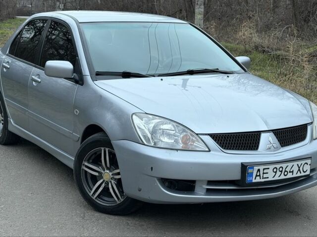 Серый Мицубиси Лансер, объемом двигателя 1.6 л и пробегом 225 тыс. км за 3300 $, фото 1 на Automoto.ua