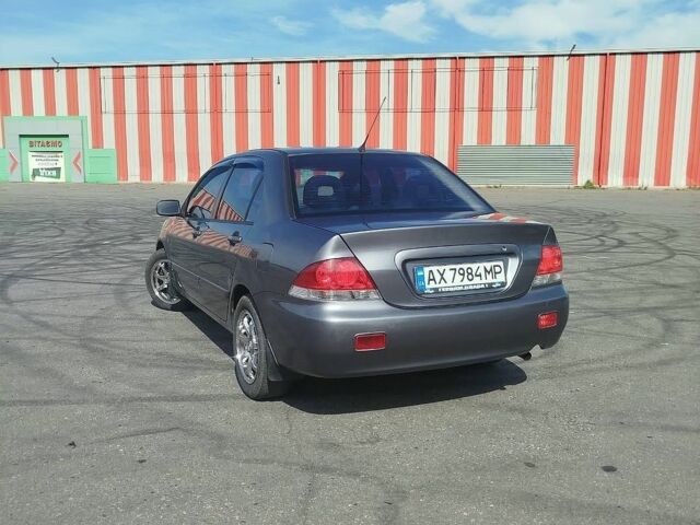 Сірий Міцубісі Lancer, об'ємом двигуна 1.6 л та пробігом 285 тис. км за 3300 $, фото 1 на Automoto.ua