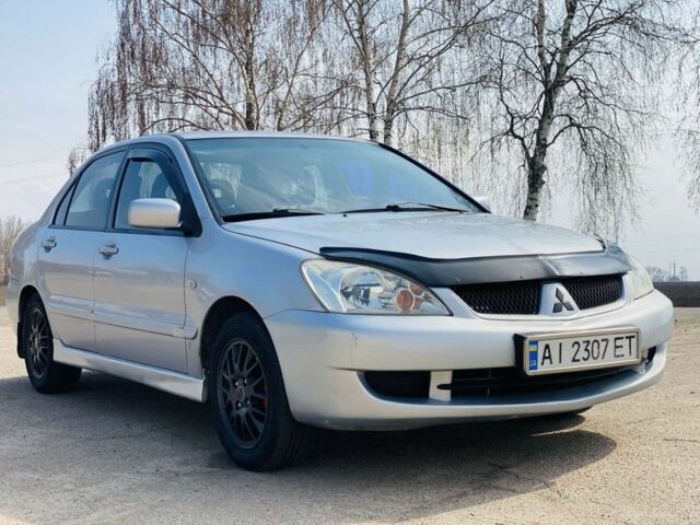 Серый Мицубиси Лансер, объемом двигателя 1.6 л и пробегом 369 тыс. км за 2600 $, фото 1 на Automoto.ua