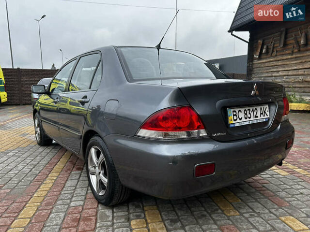 Сірий Міцубісі Lancer, об'ємом двигуна 1.6 л та пробігом 230 тис. км за 2450 $, фото 1 на Automoto.ua
