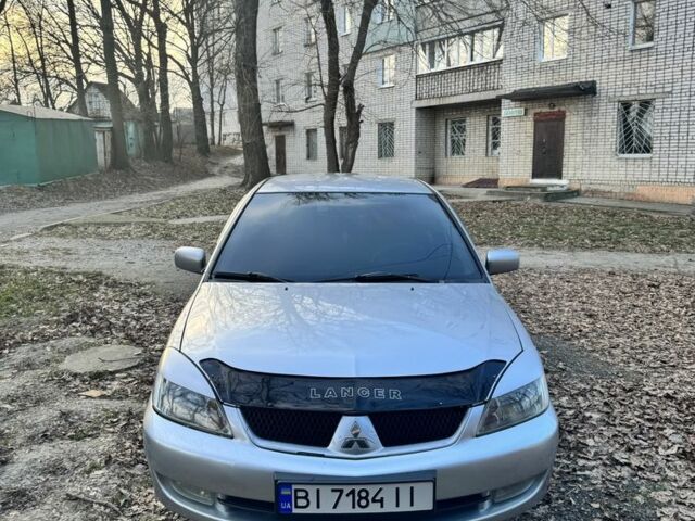 Сірий Міцубісі Lancer, об'ємом двигуна 1.6 л та пробігом 265 тис. км за 3800 $, фото 1 на Automoto.ua
