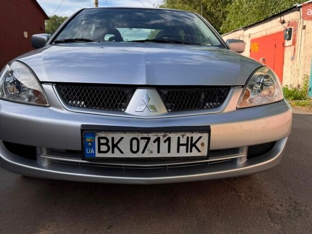 Сірий Міцубісі Lancer, об'ємом двигуна 1.58 л та пробігом 276 тис. км за 4100 $, фото 1 на Automoto.ua